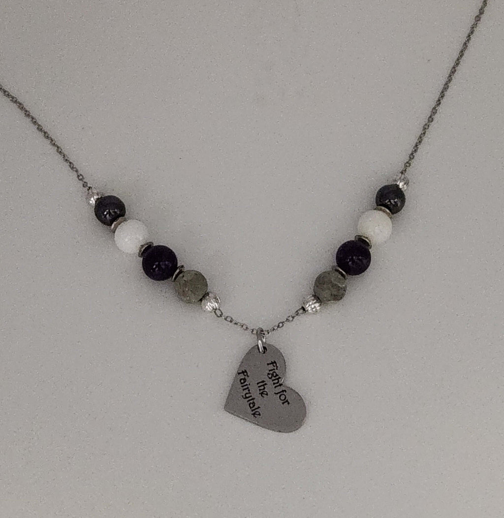 Celebrate identity with this demisexual pride necklace. Silver-plated, nickel-free stainless steel with a heart pendant engraved “Fight for the Fairytale.” Adjustable 18–20 inches.