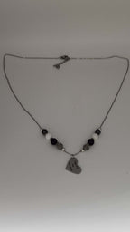 Celebrate identity with this demisexual pride necklace. Silver-plated, nickel-free stainless steel with a heart pendant engraved “Fight for the Fairytale.” Adjustable 18–20 inches.