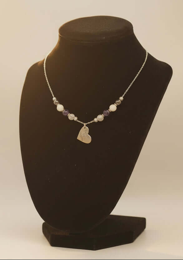 Celebrate identity with this demisexual pride necklace. Silver-plated, nickel-free stainless steel with a heart pendant engraved “Fight for the Fairytale.” Adjustable 18–20 inches.