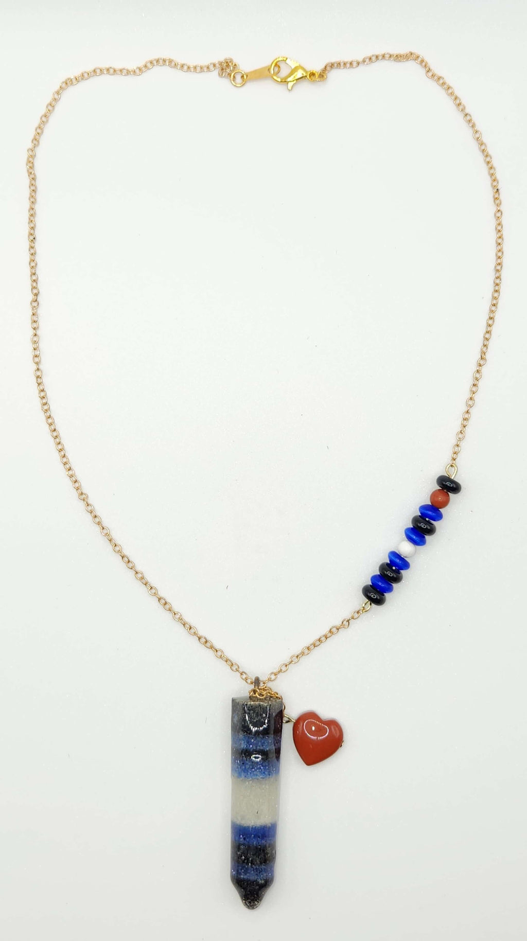 Bold Leather Pride necklace crafted with genuine gemstone sand and premium materials. On gold-plated chain with natural stones.