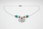 Premium transgender pride necklace featuring blue magnesite, rose quartz, and mother of pearl. Nickel-free, plastic-free, silver-plated stainless steel with engraved heart pendant.